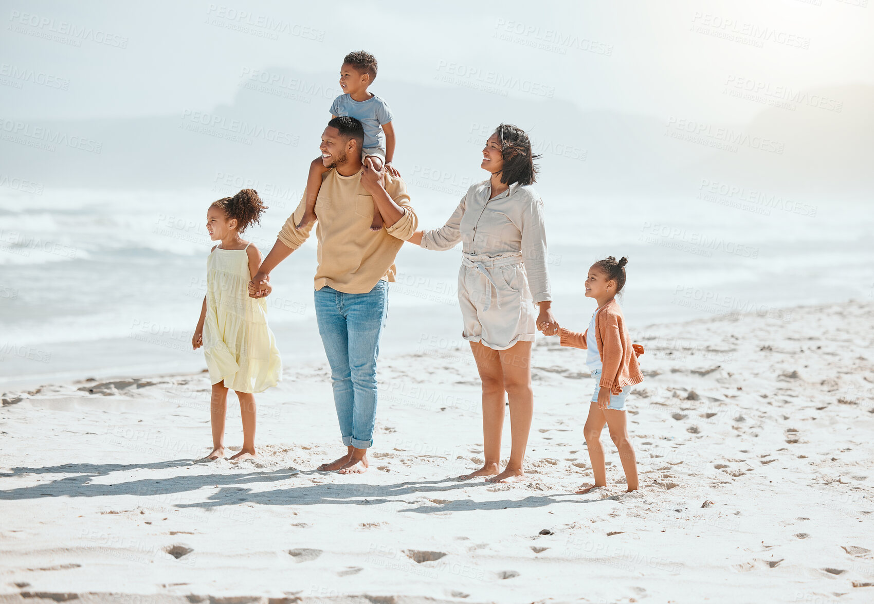 Buy stock photo Relax, holding hands and solidarity with family at beach for travel destination, summer or vacation. Love, tropical and adventure with parents and children for holiday, bonding and happiness together