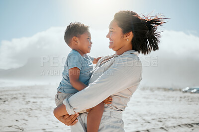 Buy stock photo Love, smile and mother with son at beach for travel destination, summer and vacation. Relax, tropical and adventure with woman and holding child for family holiday, bonding and happiness together