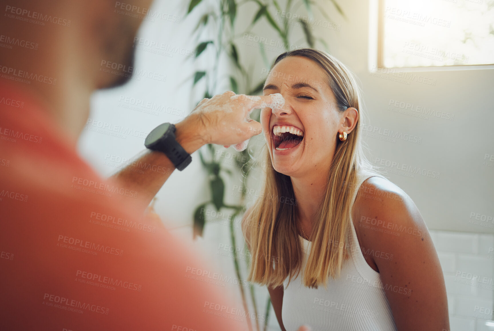 Buy stock photo House, playing and happy couple with cream, smile and love for relationship bonding or skincare. Morning routine, nose and silly people in bathroom laughing with foam, beauty and face with funny joke