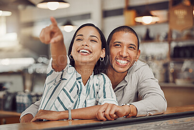 Buy stock photo Date, laughing and pointing with couple in coffee shop together for bonding, relationship or romance. Hug, love or smile with happy man and woman in cafe or restaurant for comfort or relaxation