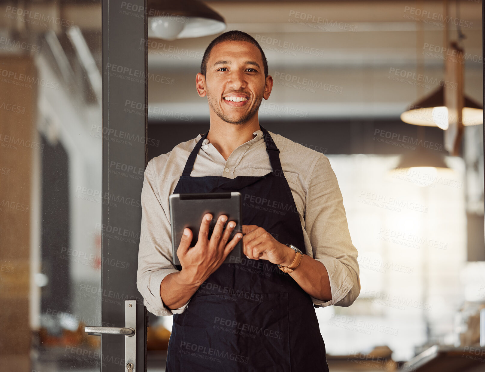 Buy stock photo Portrait, happy man and cafe owner with tablet for sales, inventory check or menu in small business. Face, coffee shop and entrepreneur with technology, waiter or barista by door at startup in Mexico