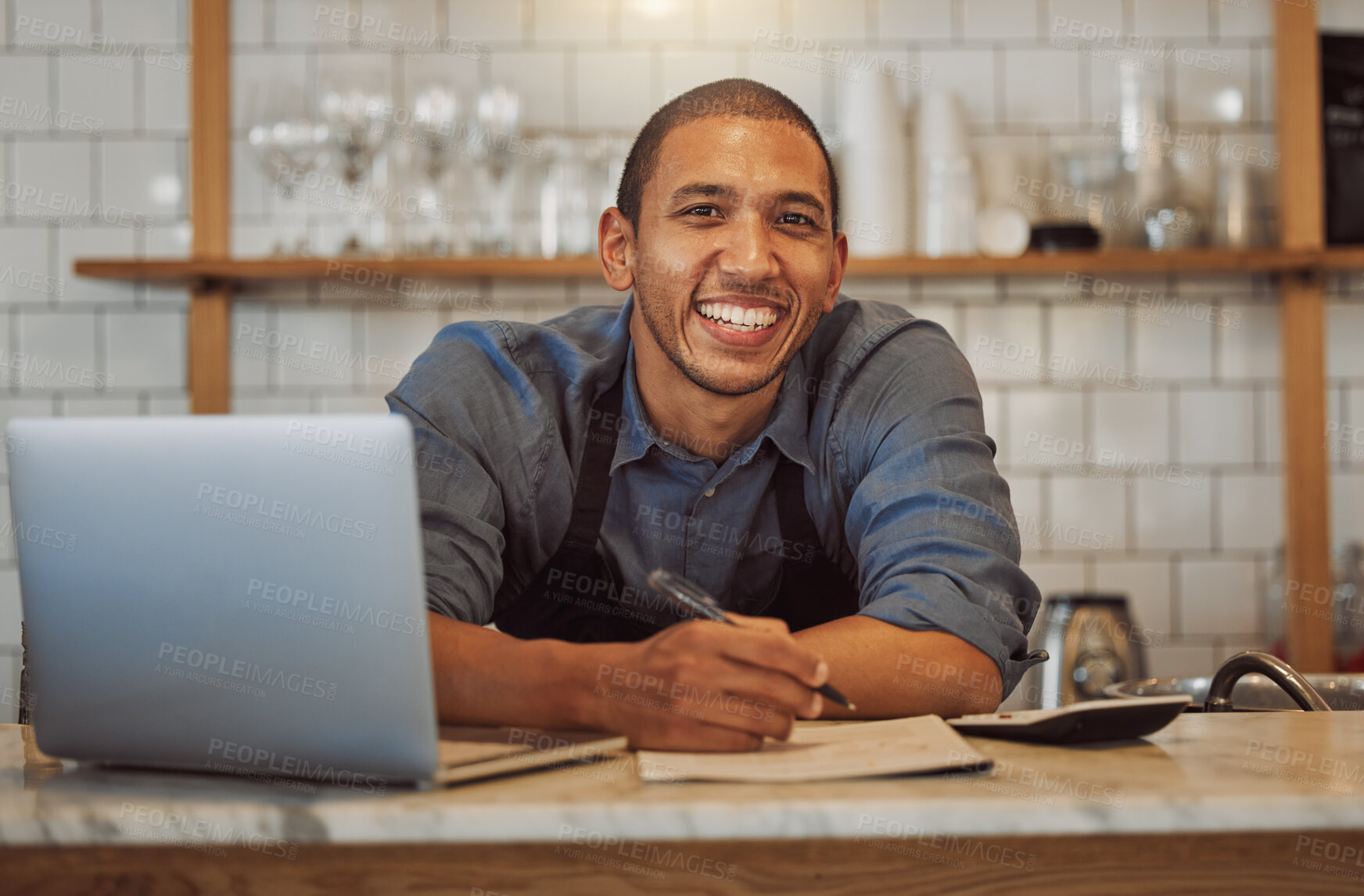 Buy stock photo Cafe, happy man and portrait of barista writing order on menu for stock check or calculate sales at startup. Face, coffee shop and entrepreneur with laptop, waiter or owner at small business in Chile