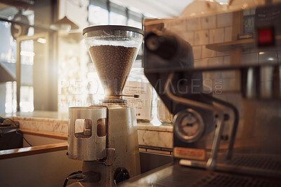 Buy stock photo Electric machine, grinder and coffee beans in cafe for cappuccino, espresso or latte order. Hospitality industry, small business and appliance for hot beverage preparation at diner or restaurant