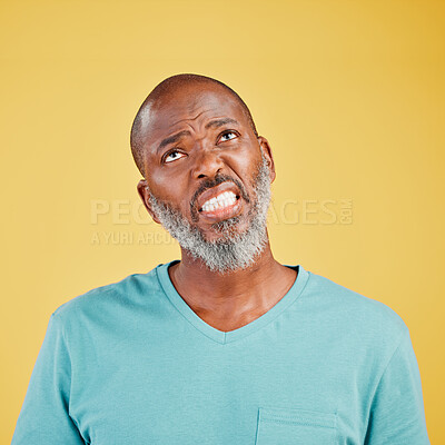 Buy stock photo Thinking, frustrated and mature black man in studio with memory, problem solving or decision. Remember, doubt and confused person with brainstorming, ideas and planning choice on yellow background