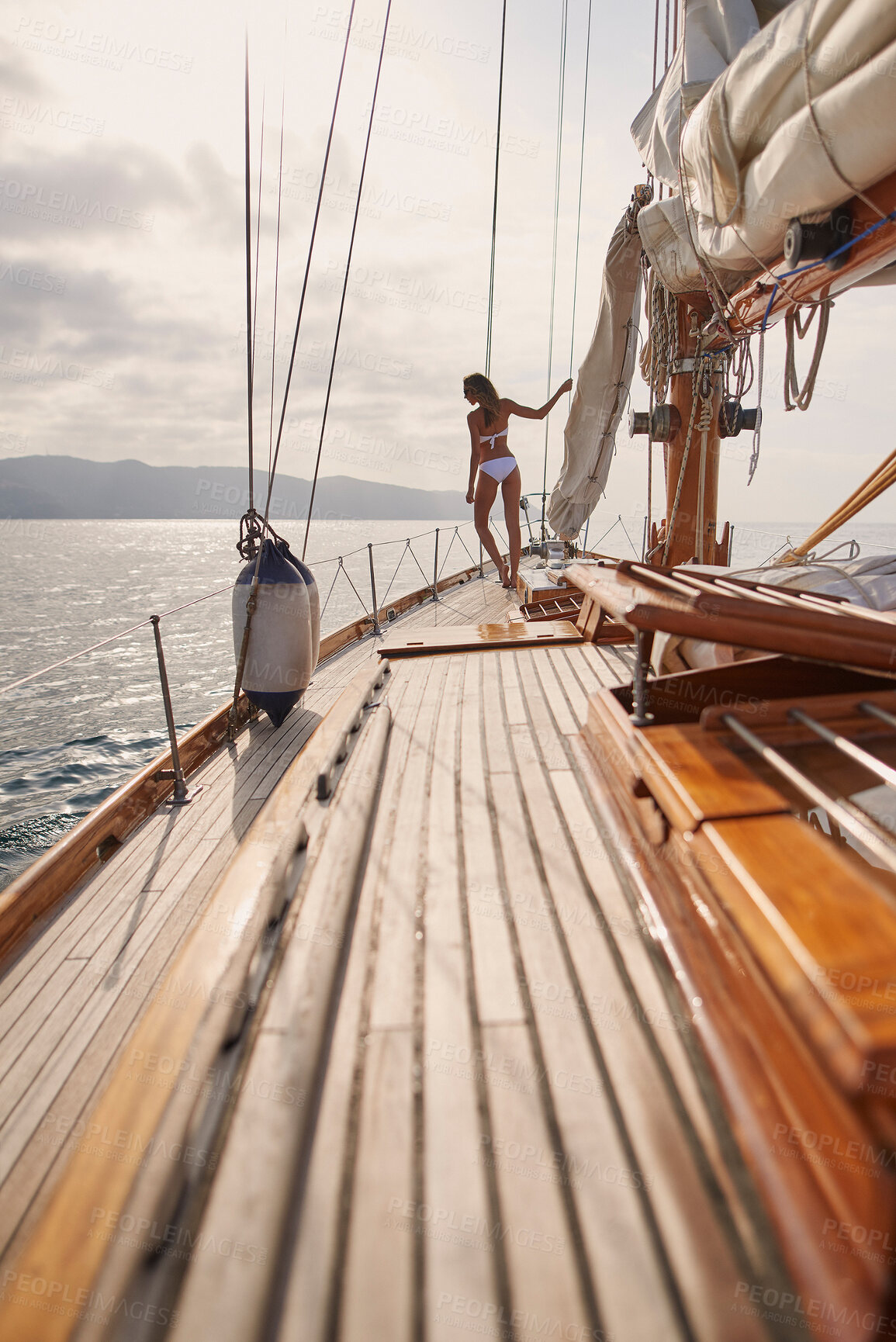 Buy stock photo Adventure, swimsuit and woman on boat by ocean for holiday, vacation or getaway for summer. Relax, luxury and female person in bikini for sailing in sea for tropical weekend trip transportation.