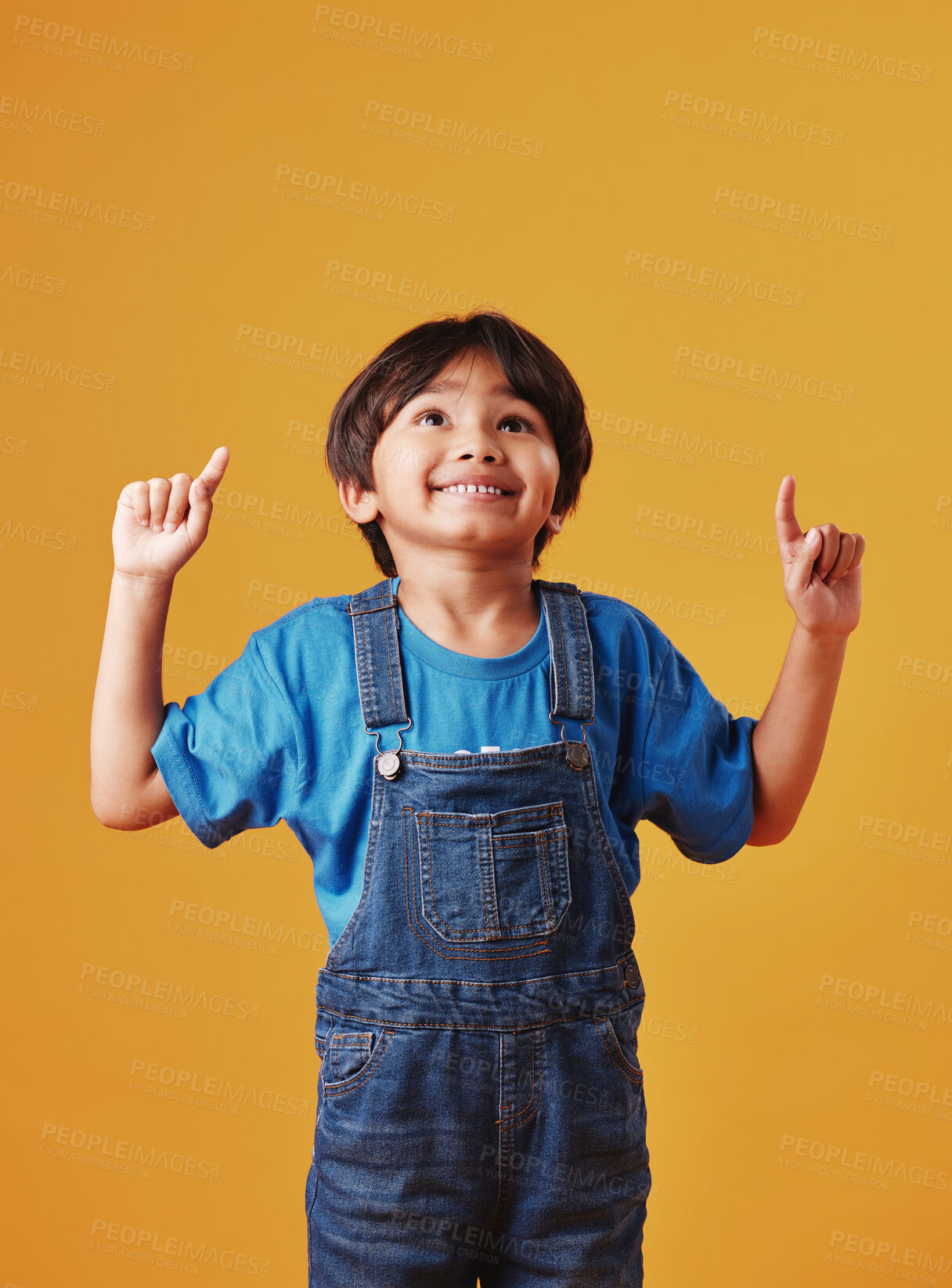 Buy stock photo Kid, pointing up and boy with announcement, showing and promotion on studio background. Model, opportunity and childhood with discount deal, notification and alert with option, direction or choice