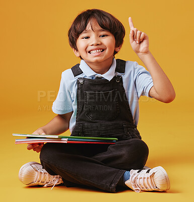 Buy stock photo Books, education and portrait of child with question in studio for studying with test for development. Scholarship, student and Asian kid with learn elementary school for future by yellow background.