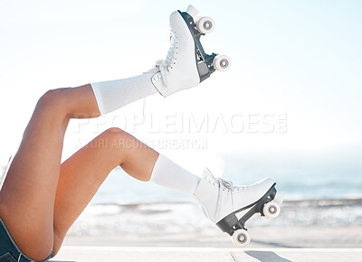 Buy stock photo Roller skates, travel and summer vacation and beach fun with woman enjoying hobby, relax and freedom while skating. Legs and retro footwear of a fit female skater out for active adventure by the sea