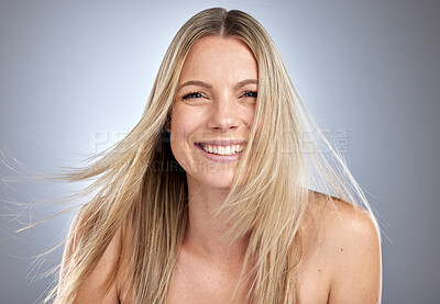 Buy stock photo Hair care, wellness and portrait of a happy woman in studio with hair treatment. Happiness, smile and female model from Australia with long, shiny and straight hair style.