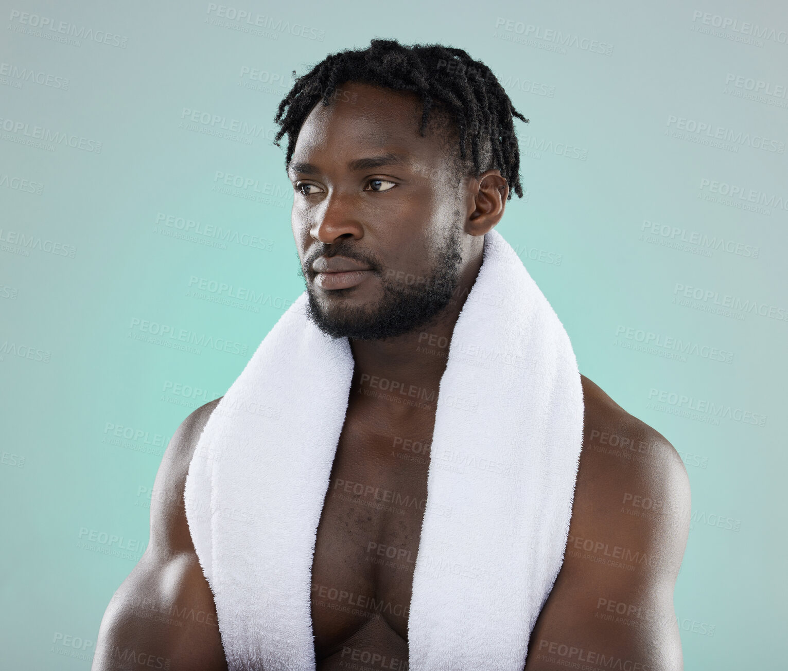 Buy stock photo Wellness, grooming and black man thinking of a shower, cleaning and isolated on a blue background. Beauty, health and African model with a towel for cosmetic morning routine on a studio backdrop