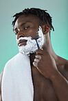 Black man, studio and cream for shaving, beauty or razor for facial, cosmetics or skincare by blue background. African gen z model, hair removal foam and shave for aesthetic, cleaning and self care