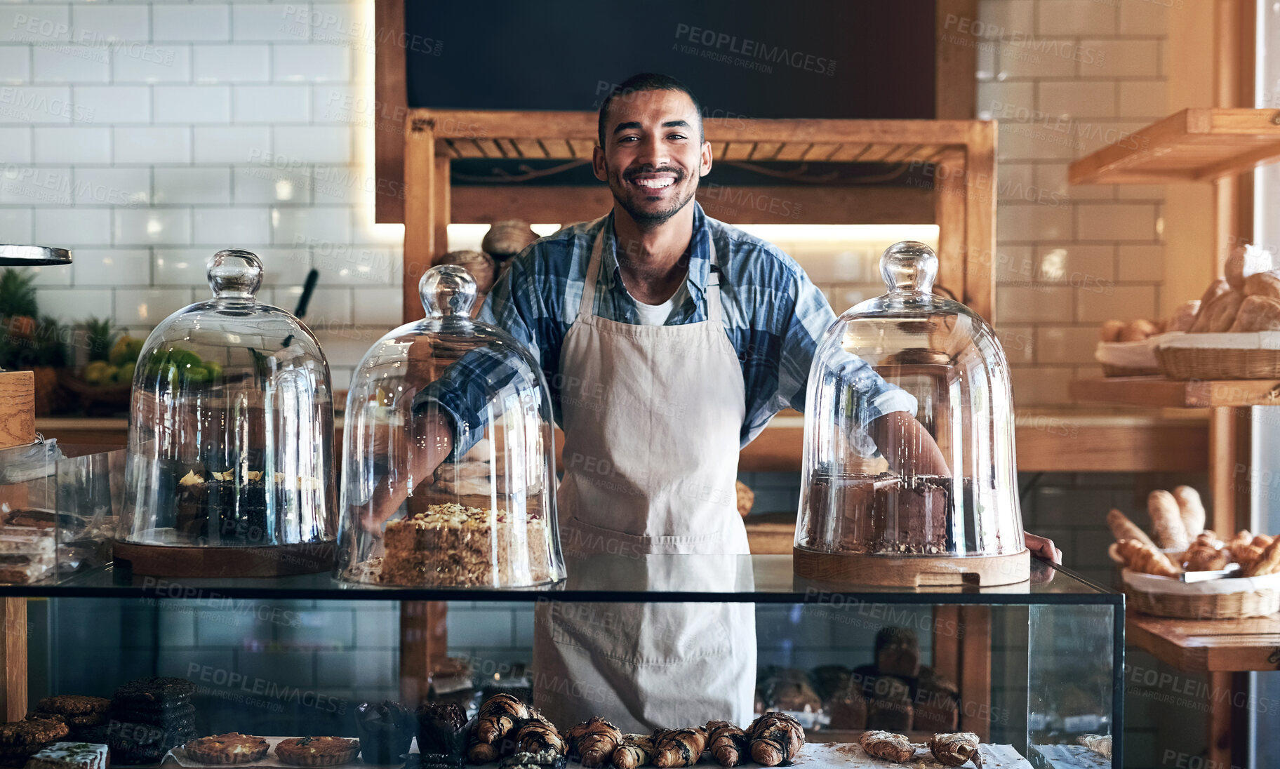 Buy stock photo Bakery, happy and portrait of man in cafe ready for serving pastry and baked foods for small business. Restaurant, coffee shop and confident waiter or barista by counter for service, help and welcome