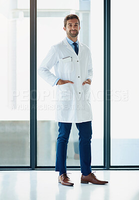 Buy stock photo Portrait of a young doctor standing in a hospital