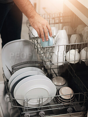 Buy stock photo Cleaning, loading dishwasher and hands with dishes in the kitchen for housework and responsibility. Lifestyle, morning and a person doing housekeeping, organizing crockery and clean equipment