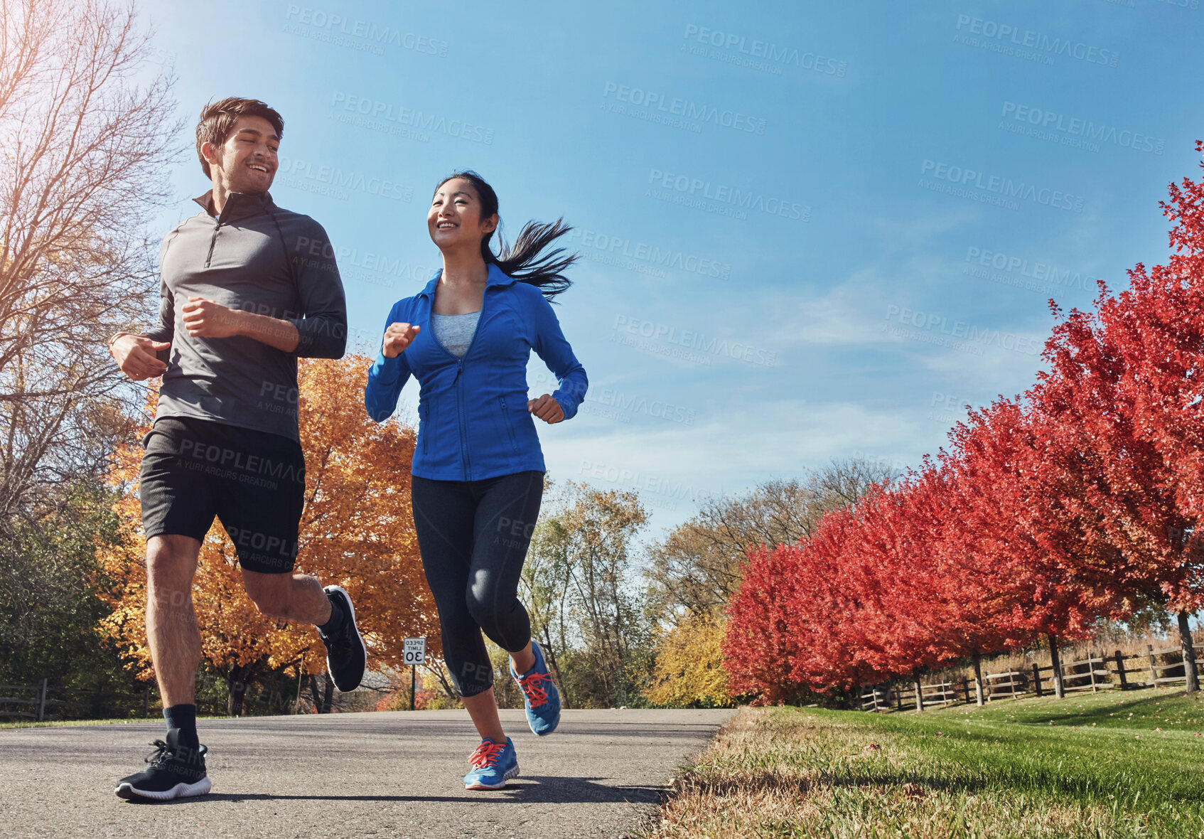 Buy stock photo Happy couple, running and outdoor workout with partner in nature for exercise or cardio together. Fitness man, woman or runners with smile and enjoying sprint, race or jog on path in countryside