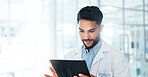 Doctor, reading and planning on tablet for healthcare report, information or medical results with hospital software solution. Man with digital tech for clinical research forum and online registration