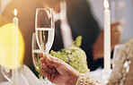 Alcohol, champagne and hands of at party for celebration, social event and gathering. Glass, luxury restaurant and people with liquor for cheers, toast and drinks at gala, new years eve or wedding