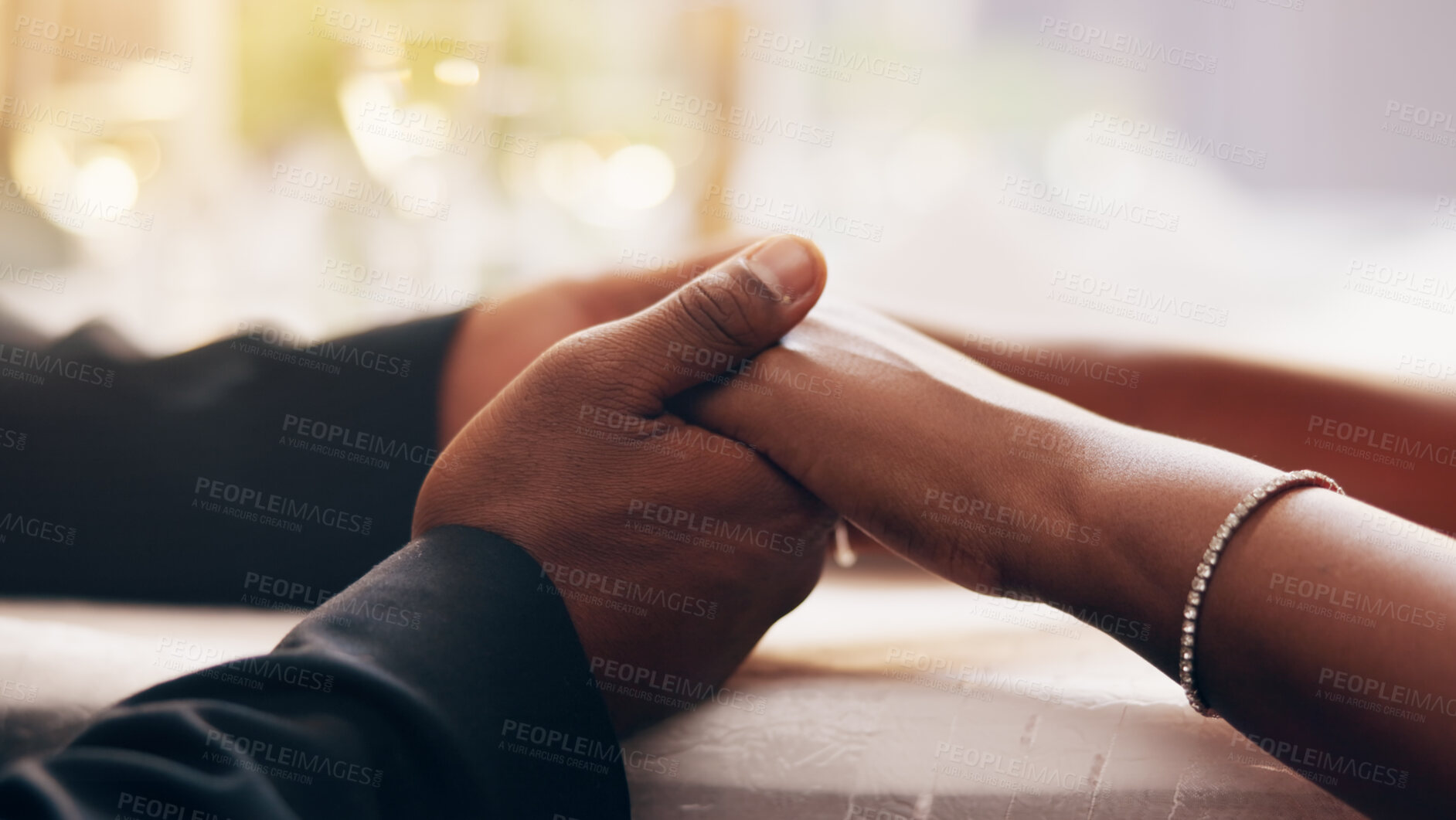 Buy stock photo Couple, empathy and bonding with holding hands for together, help and care in home for dinner. People, trust and support for healthy conversation or compassion for love, connection and romantic date