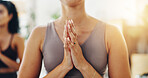 Hands, namaste and woman in yoga class for meditation, self care and holistic balance at health retreat. Zen, mindfulness and girl with wellness for mind, body and soul for gratitude, peace and calm