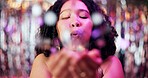 Portrait, woman and blowing confetti in celebration as gen z for birthday, festival or new years eve. Female person, glitter and happy for party, carnival or disco as content creator for social media