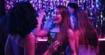 Dancing, fun and friends in club, night and smile of women, bonding and celebration in weekend or group. Lights, dark and listening to music, dancer and people in rave, disco or festival in New Year