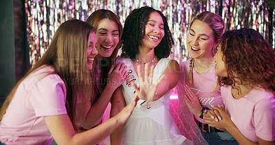 Buy stock photo Bachelorette party, wedding ring and surprise with friends at club for bride to be, announcement and night out. Support, bridal shower and celebration with people for social event, women and group