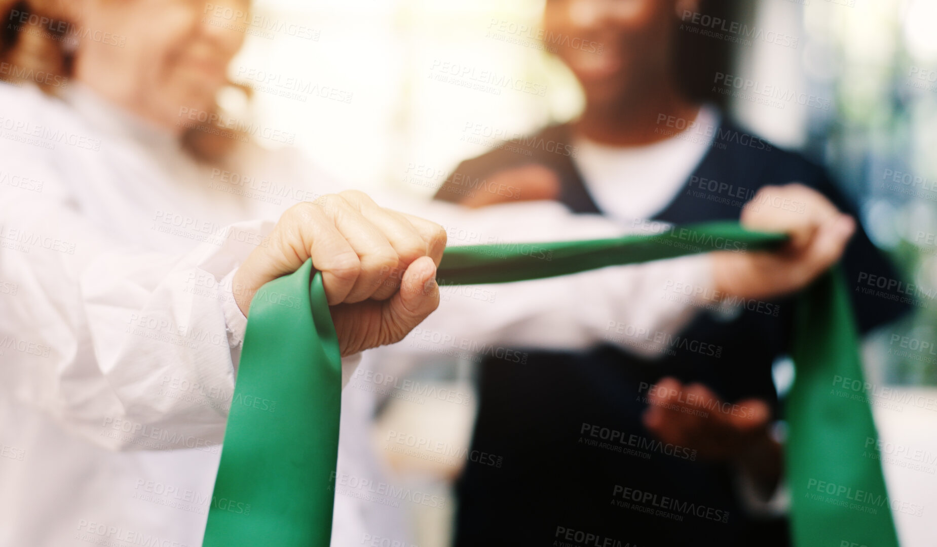 Buy stock photo Hands, rehabilitation or resistance band with patient and physiotherapist in clinic for recovery. Exercise, fitness or training with person and practitioner in office of hospital for improvement