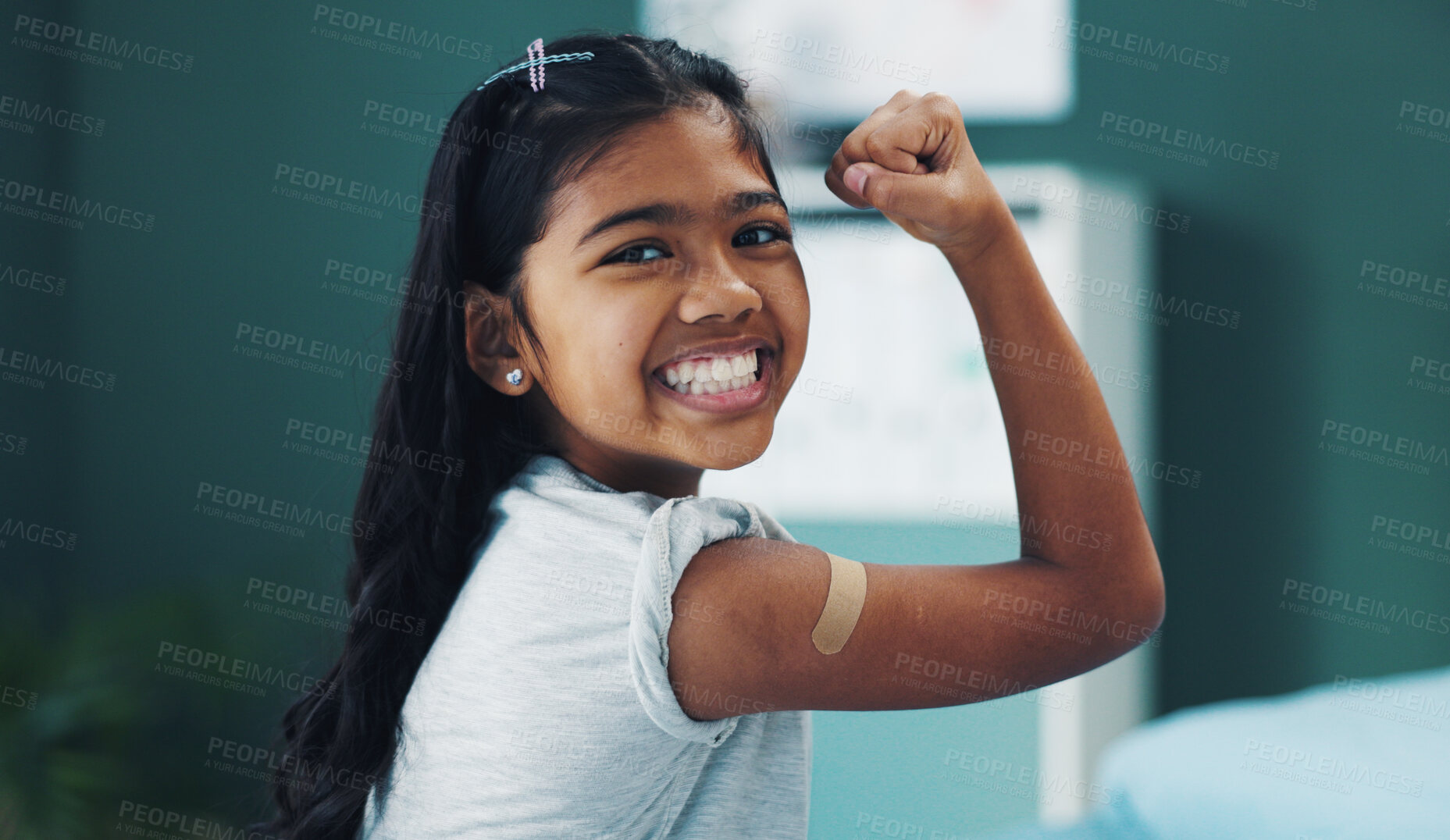 Buy stock photo Child, girl and strong in portrait with plaster for vaccine shot, injection and immunization at hospital. Kid, happy and arm flex in clinic with bandage for healthcare service and disease protection