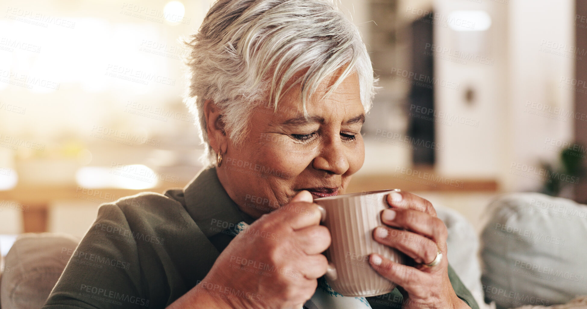 Buy stock photo Senior woman, home and smell aroma of coffee for peace, quiet and comfortable couch in retirement. Female person, happy and breathing in scent of cappuccino for calm, hot chocolate and thinking