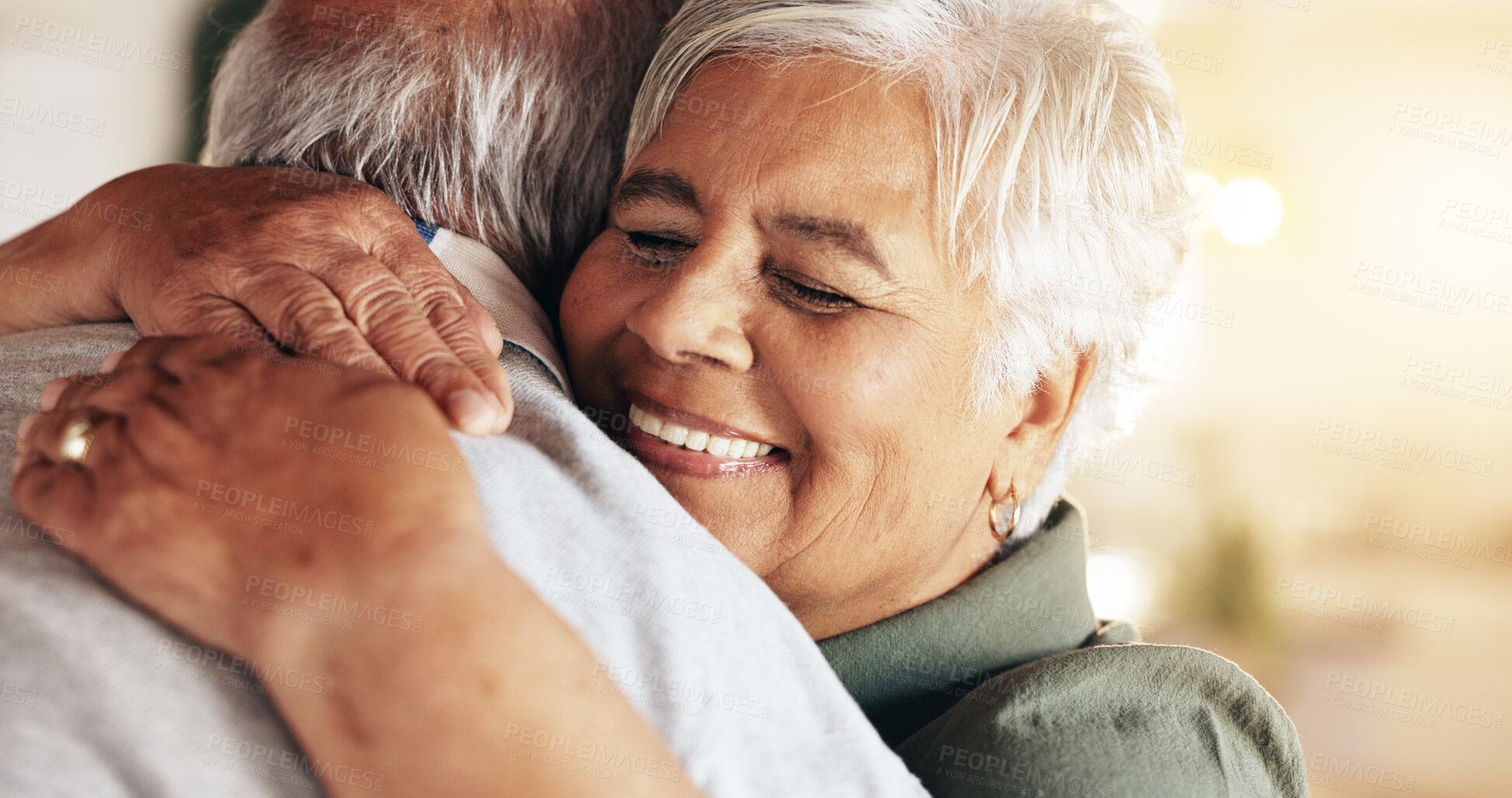 Buy stock photo Senior couple, hug and home with love, care and support together with retirement and marriage. Embrace, empathy and bonding with happy, smile and sweet comfort with elderly woman and anniversary