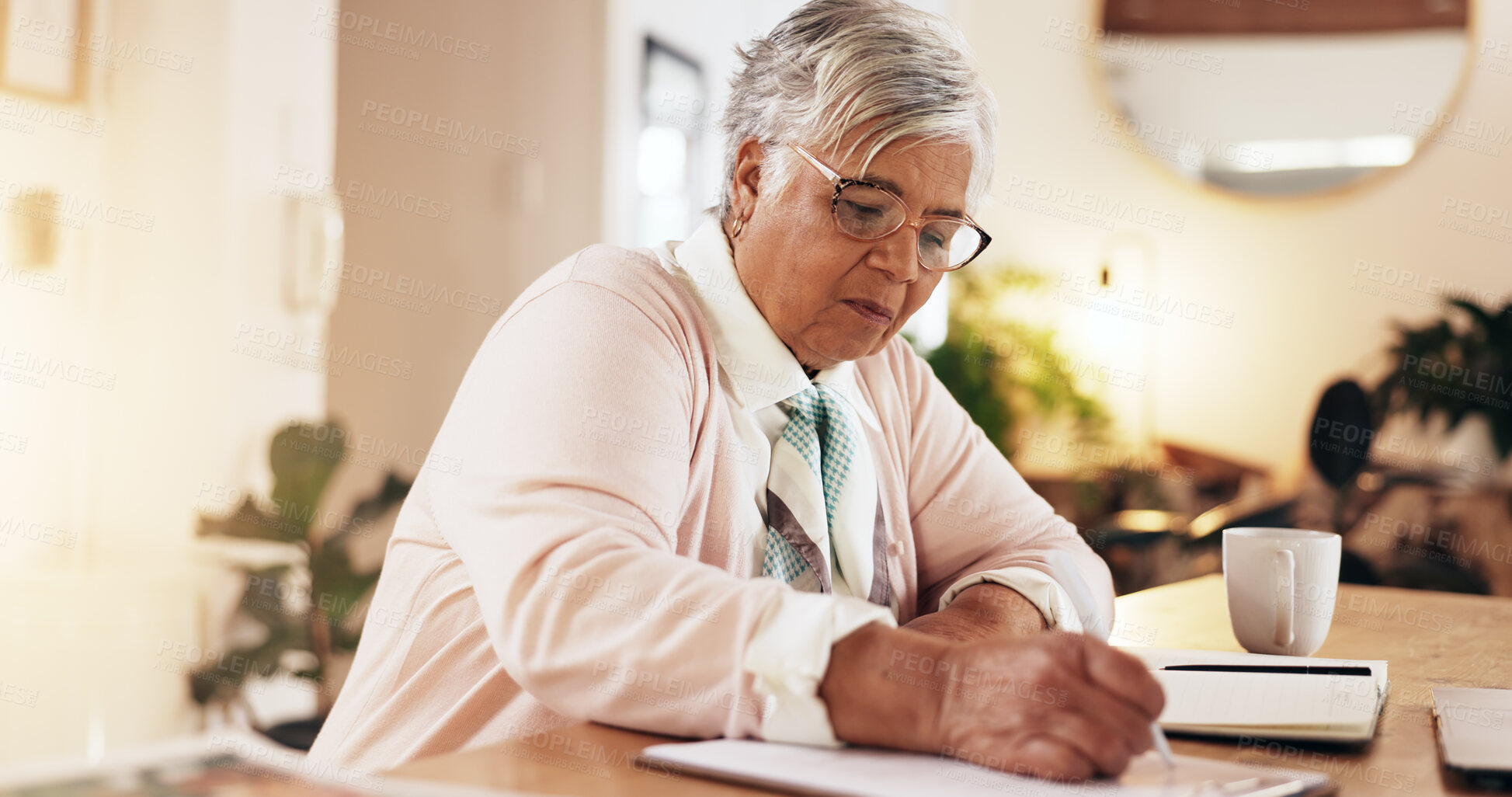 Buy stock photo Senior woman, writing and paper in home for pension application, retirement funding and medical information. Elderly person, document and reading in lounge for personal finance with checklist on form