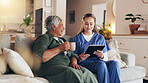 Nurse, tablet and consultation with senior woman in home with results, news or coffee for medical report on sofa. People. caregiver and digital touchscreen with laugh, healthcare and support with app