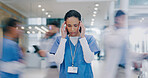 Nurse, woman and headache in hospital with stress of medical mistake, overworked and burnout. Motion blur, healthcare worker and migraine in busy clinic with fatigue, crisis and frustrated for chaos