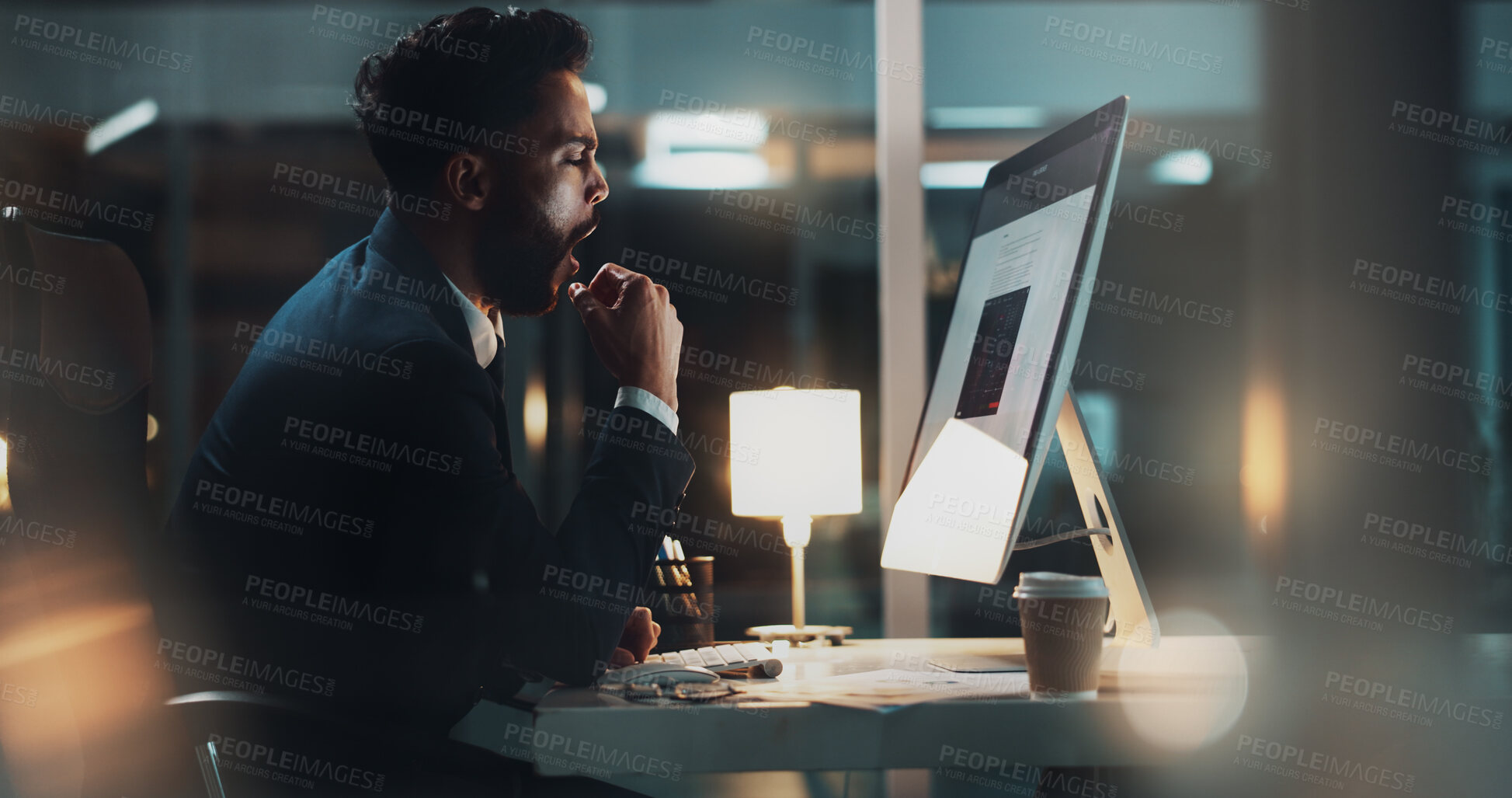 Buy stock photo Night, man and tired at computer for business, fatigue and overworked in office. Accountant, burnout and yawn at tech screen with boredom, exhausted and working overtime for deadline and commitment