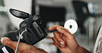 Man, hands and photographer with camera for production, film making or photoshoot at studio. Closeup, male person or producer working with screen or lens for content creation or media at workplace