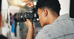 Photography, fashion and camera with man in studio for magazine production, backstage and wardrobe set. Artist, photoshoot and creative with person for ecommerce catalog, shooting and picture