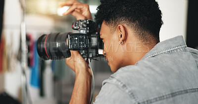 Photography, fashion and camera with man in studio for magazine production, backstage and wardrobe set. Artist, photoshoot and creative with person for ecommerce catalog, shooting and picture