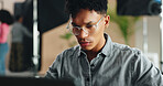 Man, photographer and glasses with laptop for production, film making or design at studio. Young, male person or producer working on computer for content creation, research or media app at workplace