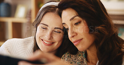 Buy stock photo Home, mother and daughter with tablet for smile, comedy movie and streaming series with subscription. Face, mature mom and adult child with digital for watch video, entertainment and relax as family