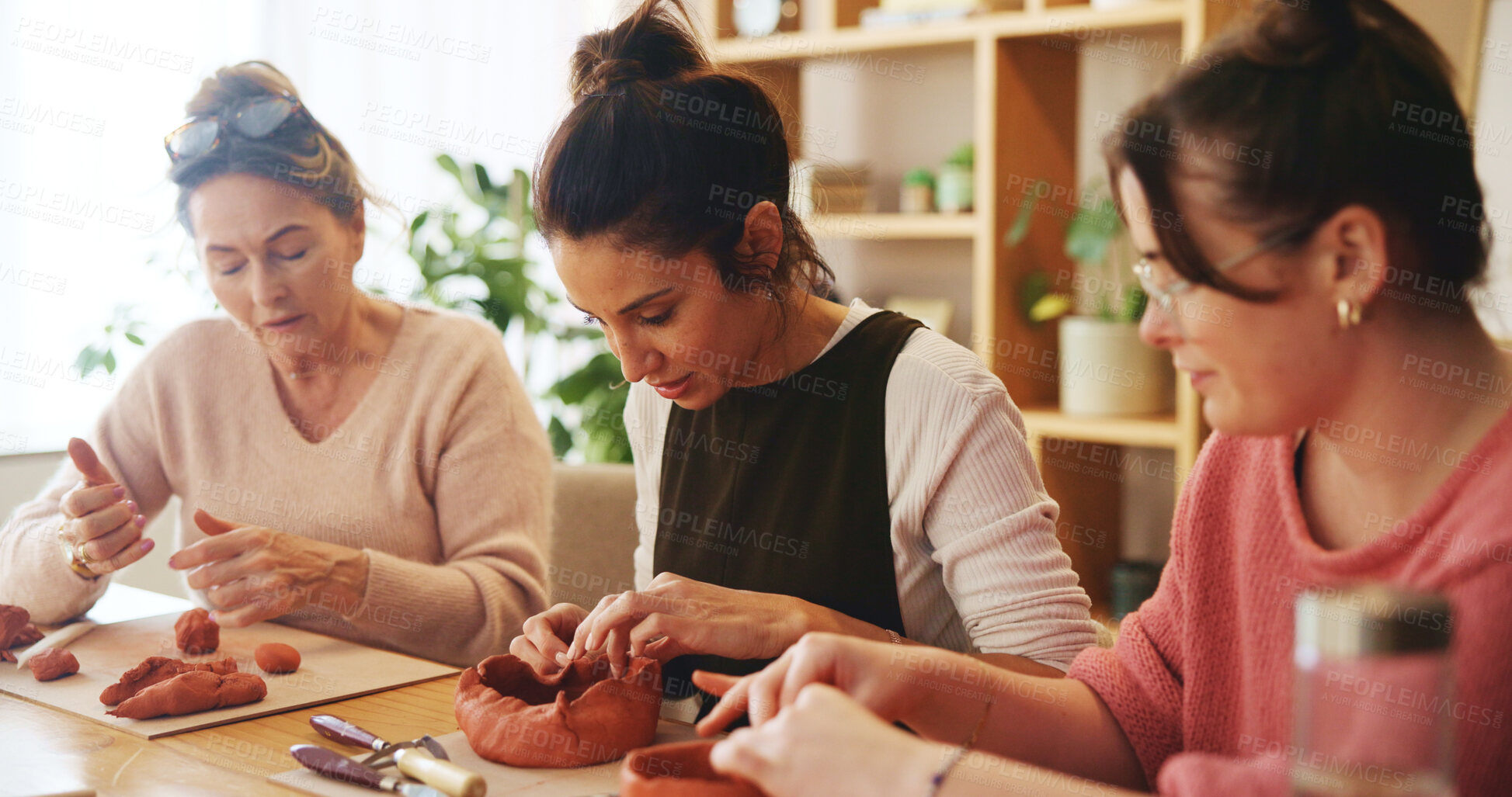 Buy stock photo Pottery class, workshop or women clay sculpture for molding texture, manufacturing or art product. People, ceramic retail store or learning in small business with artists for hobby or craft project