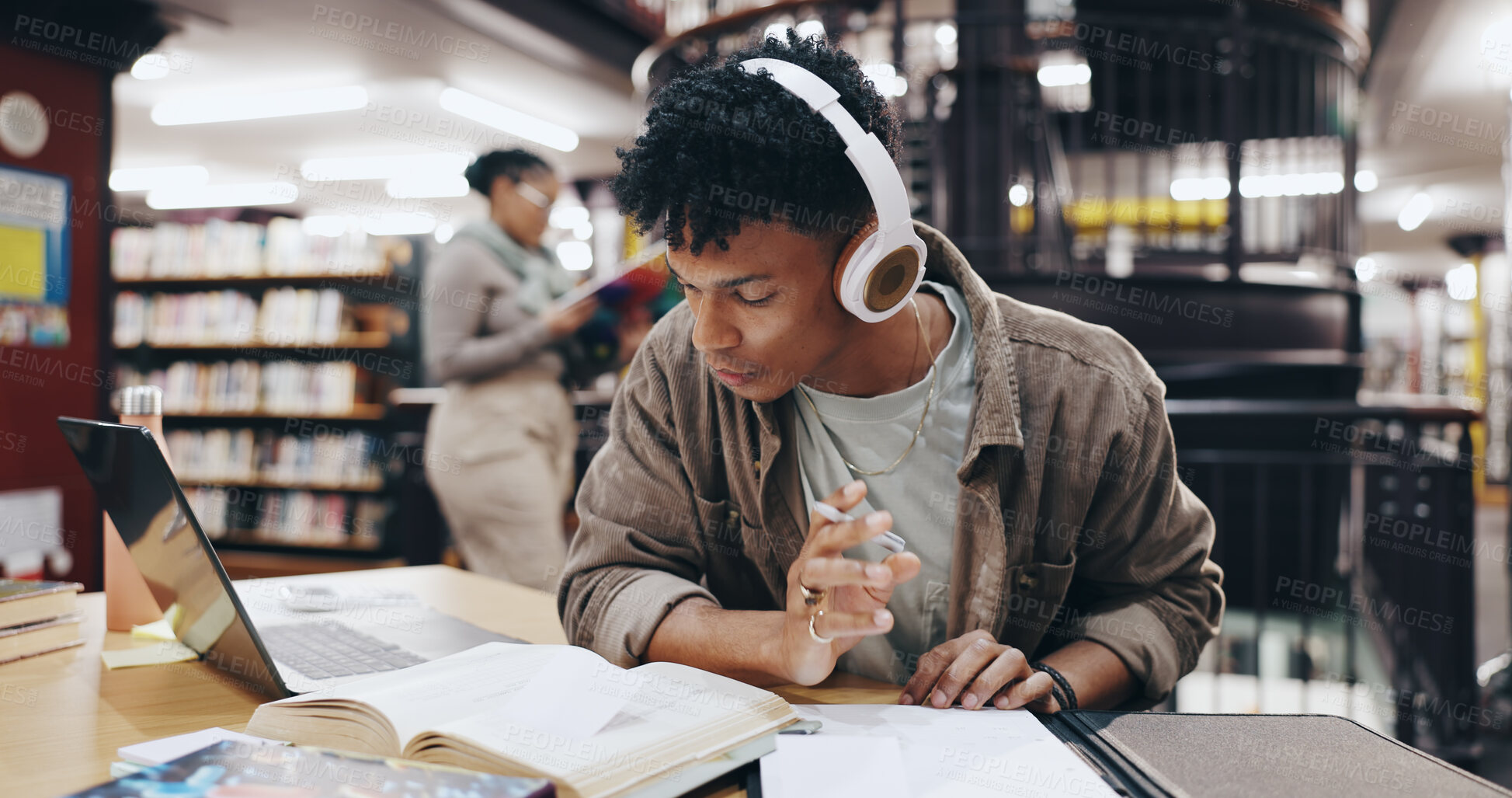 Buy stock photo Music, book and research with man in library for knowledge, education and college thesis. Headphones, future and university with student and studying on campus for exam, project and scholarship