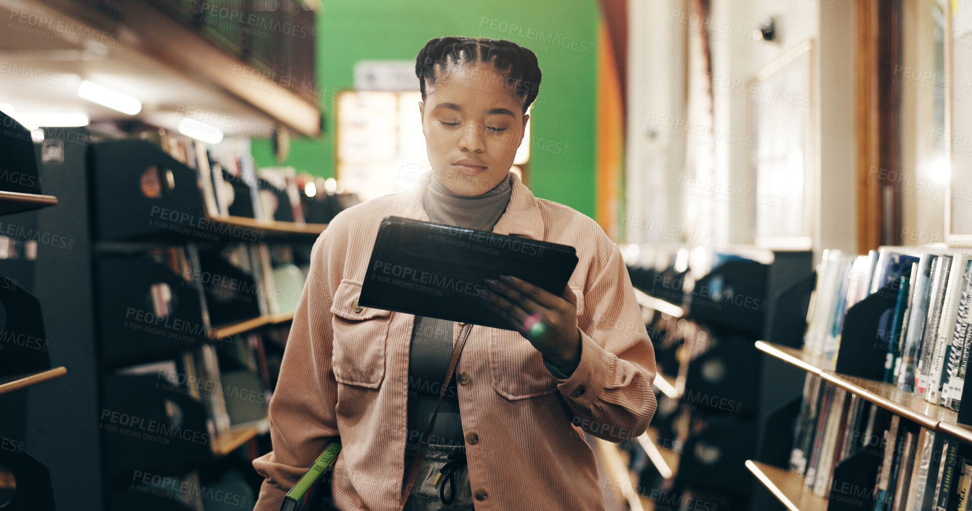 Buy stock photo African, woman and student with tablet in library for research information, university news and study schedule. Girl, digital and reading online with education ebook, exam results and project report