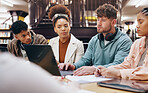 University, students and study group with laptop in library for exam preparation, homework assignment or research project. People, discussion and notes for learning, knowledge and scholarship test