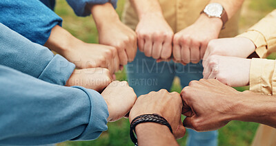 Buy stock photo Hands, fist and students with teamwork outdoor for education support, learning success and studying. People, friends and collaboration with college future, scholarship and celebration of synergy goal