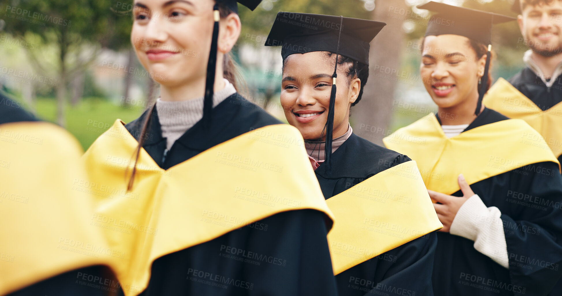 Buy stock photo Row, graduation and students outdoor at university for achievement in degree, certificate or diploma. Happy, excited and woman with friends in line for education study goal ceremony at college.