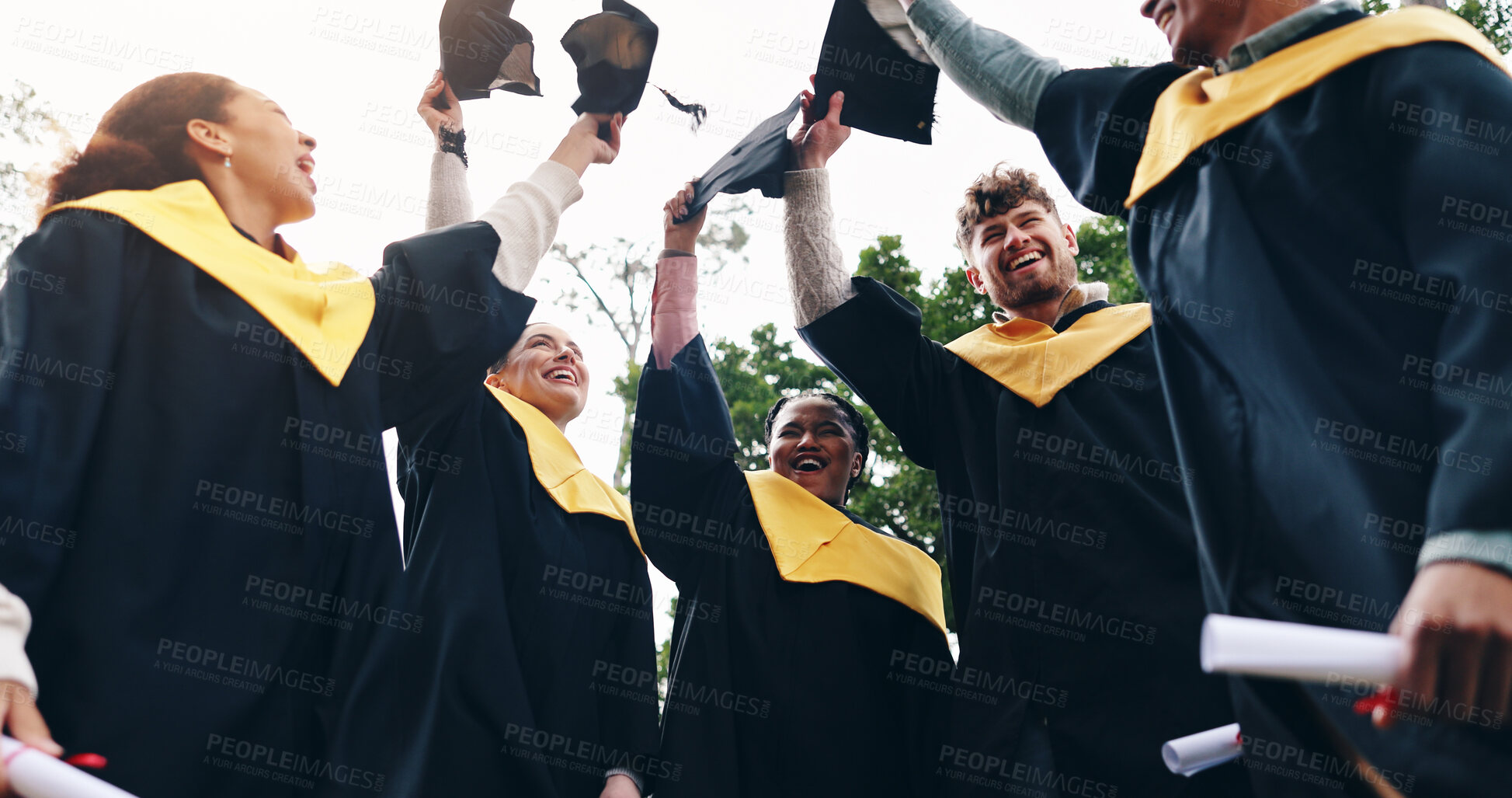 Buy stock photo Students, victory and graduation cap in sky on campus with celebration and success People, college and university classmate or friends with smile or happy for qualification, education and achievement