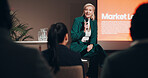 Mature woman, stage and seminar with microphone for leadership skills, information or knowledge. Female person, public speaker and presentation at global summit, conference or motivation in uplifting