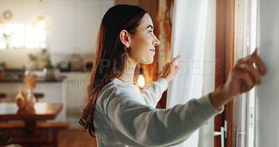 Buy stock photo Woman, window and open curtains in house for start day, fresh air and check weather in living room. Girl, smile and drapes for awake, getting ready and morning routine with thinking of apartment view