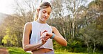 Girl, runner and check smart watch in nature for running performance, tracking speed and fitness monitor. Athlete, person and biometric in forest for wellness progress, heart rate and workout outdoor