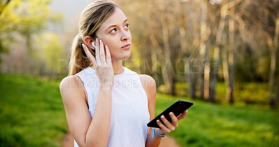 Buy stock photo Girl, thinking and phone in nature with fitness for running performance, tracking speed and marathon monitor. Athlete, runner and biometric in forest for wellness progress, music or earphones outdoor